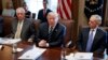 President Donald Trump speaks during a cabinet meeting at the White House as Secretary of State Rex Tillerson, left, and Secretary of Defense Jim Mattis, right, listen, Oct. 16, 2017.