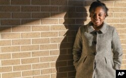 FILE - Joycelyn Davis, a direct descendant of Clotilda survivor Charlie Lewis, stands for a portrait at the community center in Africatown in Mobile, Ala., Jan. 29, 2019.