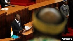 Ivory Coast's President Alassane Ouattara addresses the Ivorian parliament during the presentation of a new constitution in Abidjan, Oct. 5, 2016.