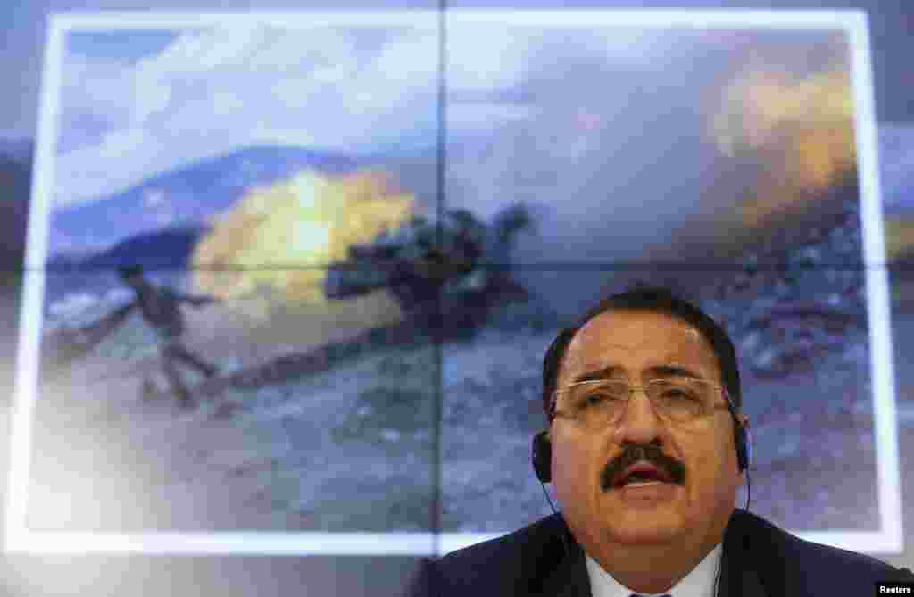 Syria's ambassador to Russia, Riad Haddad, speaks during a news conference in Moscow, Oct. 1, 2015. 