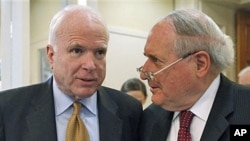 Sen. Carl Levin (R) and Senator John McCain talk about the Chinese government's failure to cooperate in an ongoing Senate Armed Services Committee investigation into counterfeit parts in the Defense Department supply chain, on Capitol Hill in Washington, 