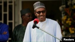 FILE - Nigeria's President Muhammadu Buhari speaks during a news conference after the Summit of Heads of State and Government of The Lake Chad Basin Commission (LCBC) in Abuja, Nigeria, June 11, 2015.