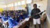 FILE - Pupils revise their class work without a teacher on the second week of a national teachers' strike, at Olympic Primary School in Kenya's capital Nairobi, September 9, 2015. 
