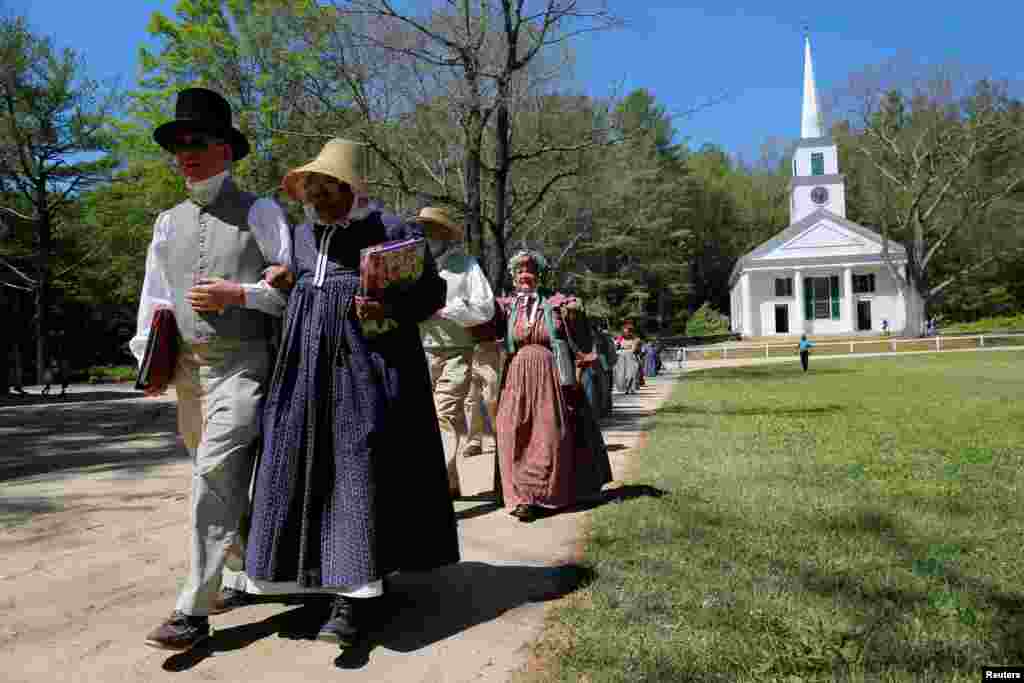 Members of the choir arrive for a naturalization ceremony, where 146 people became United States citizens, at Old Sturbridge Village in Sturbridge, Massachusetts, on Independence Day.