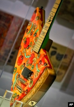 The "Pizza Guitar," from musician Andrew W.K., is part of a group art exhibition celebrating pizza at The Museum of Pizza in New York, Nov. 2, 2018.