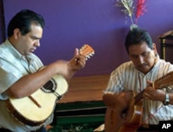 Rodriguez plays with a member of the indigenous Mexican band Mirando al Lago