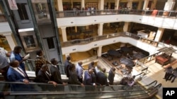 Kenyan dignitaries take a tour of the Westgate Mall, during a viewing for the media prior to it being re-opened to the public, in Nairobi, July 14, 2015. 