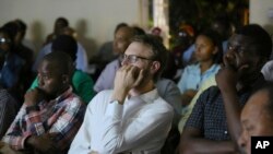 Zimbabweans watch the documentary, "Gukurahundi Genocide: 36 Years Later," during its screening in Harare, Oct. 17, 2018.