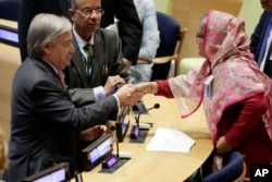 Bangladesh Prime Minister Sheikh Hasina Wazed, right, is greeted by United Nations Secretary General Antonio Guterres, left, in the High-Level meeting on the Prevention of Sexual Exploitation and Abuse, at United Nations headquarters, Sept. 18, 2017.