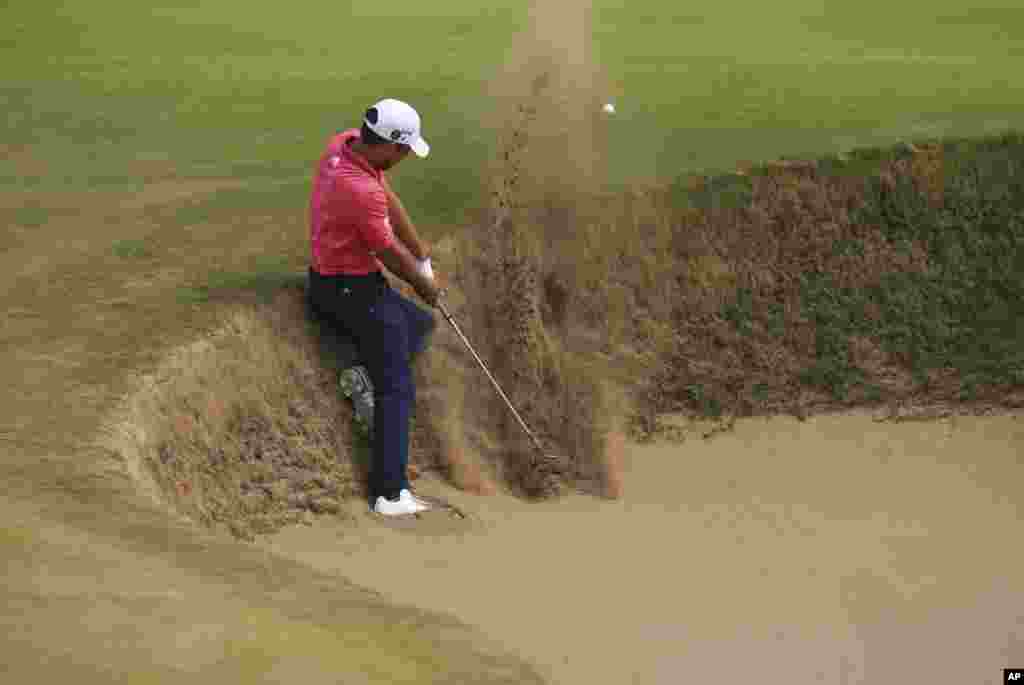 Xander Schauffele of the U.S. plays out of a bunker on the 5th hole during the final round of the British Open Golf Championship in Carnoustie, Scotland.