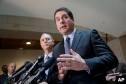 FILE - House Intelligence Committee Chairman Rep. Devin Nunes, R-Calif., right, accompanied by the committee's ranking member, Rep. Adam Schiff, D-Calif., talks to reporters, on Capitol Hill in Washington.