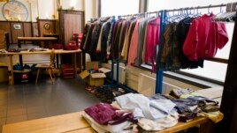 The clothes distribution station at Berlin's biggest restaurant Hofbraeu Berlin is ready for the homeless people, in Berlin, Germany, Thursday, Dec. 17, 2020. (AP Photo/Markus Schreiber)