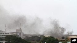 Smoke rises from the city center of Abidjan, April 2, 2011