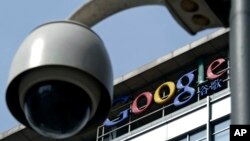 FILE -A surveillance camera is seen in front of the Google China headquarters in Beijing.