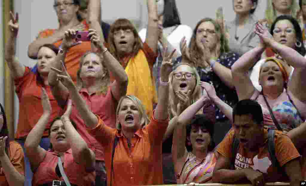 Members of the gallery cheer and chant as the Texas Senate tries to bring an abortion bill to a vote as time expires in Austin, Texas, USA. Amid the deafening roar of abortion rights supporters, Texas Republicans huddled around the Senate podium to pass new abortion restrictions, but whether the vote was cast before or after midnight is in dispute.