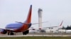 FILE - A Southwest Airlines jet waiting to depart in view of the air traffic control tower at Seattle-Tacoma International Airport in Seattle.