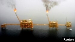 FILE - Gas flares from an oil production platform at the Soroush oil fields in the Persian Gulf, south of Tehran.