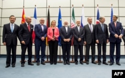 Leaders involved in Iran nuclear talks pose for group photo, July 14, 2015.