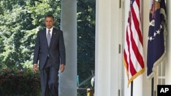 President Barack Obama walks to the Rose Garden of the White House in Washington, DC, August 31, 2011.