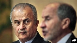 U.N. envoy Abdelilah Al-Khatib (L) and Mustafa Abdul-Jalil (R) head of the opposition's interim governing council based in Benghazi, at a joint press conference in Benghazi,Apr 1 2011