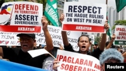 Members of the Akbayan activist group chant anti-China slogans as they march toward the Chinese consulate during a rally on the South China Sea dispute, in Makati, Metro Manila, in Philippines, July 12, 2018. Two years ago this month China lost a world arbitration court ruling to the Philippines over the legal basis for its maritime claims.