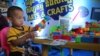 A boy plays lego at an arts and crafts station at the event celebrating the 30th anniversary of World Convention on the Rights of the Child, in Phnom Penh, Cambodia, on Nov. 20, 2019. (Kann Vicheika/VOA Khmer) 