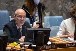 FILE - Sven Jürgenson, permanent representative of the Republic of Estonia to the United Nations, chairs a Security Council meeting, June 16, 2021, at U.N. headquarters in New York.