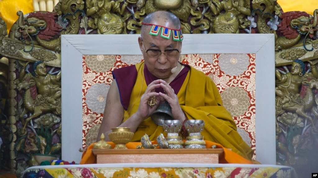 FILE - Tibetan spiritual leader the Dalai Lama prays at Tsuglakhang temple in Dharmsala, India, May 27, 2017.