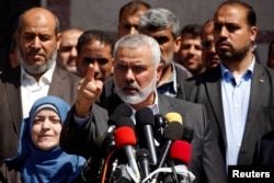 Hamas Chief Ismail Haniyeh gestures during a news conference, in Gaza City, May 11, 2017.