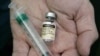 FILE - A doctor holds a vial of the human papillomavirus vaccine Gardasil in his Chicago, Illinois,, office. The southwestern African nation of Namibia is struggling with its rollout of the human papillomavirus vaccine.