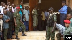 FILE - Police forces stand at the entrance of a courthouse in Yaounde, Cameroon, July 16, 2012. Ten Cameroon separatist leaders extradited from Nigeria made their first court appearance in Yaounde Friday.