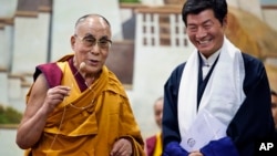 Lobsang Sangay, prime minister of the Tibetan government-in-exile, right, and the Dalai Lama visit the Tibetan Children’s Village School in Dharmsala, India, on June 5, 2014.
