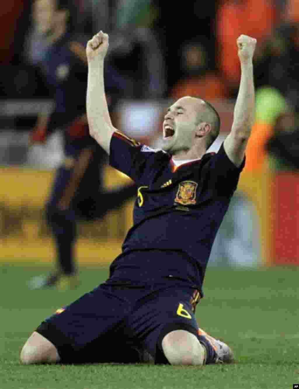 Spain's Andres Iniesta celebrates after scoring a goal during the World Cup final soccer match between the Netherlands and Spain at Soccer City in Johannesburg, South Africa, Sunday, July 11, 2010. Spain won 1-0. (AP Photo/Matt Dunham)