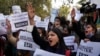 FILE - Activists shout slogans during a protest against hate speech in New Delhi, India, Dec. 27, 2021. Indian police have opened a case against a Hindu monk for making highly provocative speeches against Muslims, even calling for their extermination.