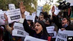 FILE - Activists shout slogans during a protest against hate speech in New Delhi, India, Dec. 27, 2021. Indian police have opened a case against a Hindu monk for making highly provocative speeches against Muslims, even calling for their extermination.