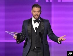 Justin Timberlake accepts the award for favorite male artist - pop/rock at the American Music Awards at the Nokia Theatre L.A. Live on Nov. 24, 2013, in Los Angeles.