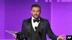 Justin Timberlake accepts the award for favorite male artist - pop/rock at the American Music Awards at the Nokia Theatre L.A. Live on Nov. 24, 2013, in Los Angeles.