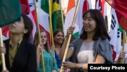 International students carry their national flags at the University of Missouri in Columbia, Missouri.