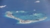 Chinese dredging vessels are purportedly seen in the waters around Mischief Reef in the disputed Spratly Islands in the South China Sea, May 21, 2015.