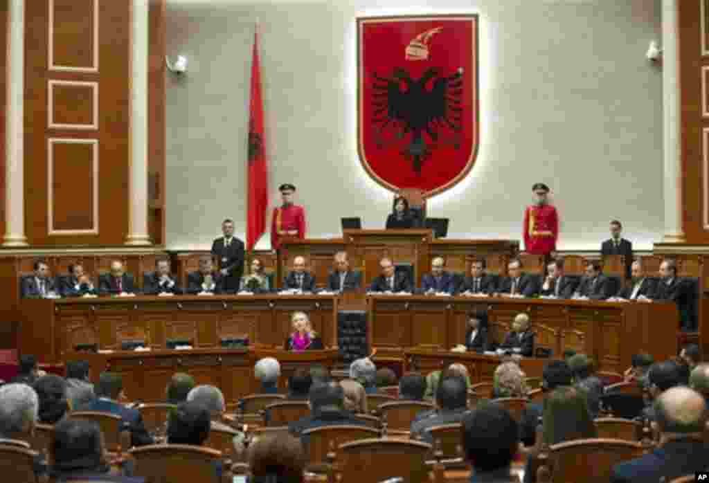 US Secretary of State Hillary Clinton, centre, speaks to the Albanian Parliament in Tirana, Albania, Thursday, Nov. 1, 2012. Hillary Clinton arrived in EU-hopeful Albania on the last leg of her Balkans tour where she is expected to urge opposing political