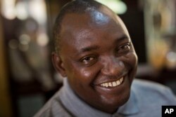 Gambian President-elect Adama Barrow sits for an interview with the Associated Press at his residence in Yundum, Gambia, Dec. 3, 2016.