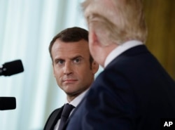 President Donald Trump speaks during a news conference with French President Emmanuel Macron in the East Room of the White House, April 24, 2018, in Washington.