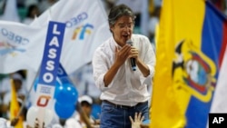 FILE - Guillermo Lasso, presidential candidate for the CREO political party, talks to the crowd during his closing campaign event ahead of the presidential runoff election in Guayaquil, Ecuador, March 30, 2017. 