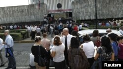 People gather in front of Costa Rica's Supreme Court building, after being evacuated from their respective buildings following a 7.9 magnitude earthquake that shook the region, in San Jose, Costa Rica, September 5, 2012.