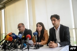 FILE - Turkish Kurd leader Abdullah Ocalan's lawyers, left to right, Faik Ozgur Erol, Newroz Uysal and Rezan Sarica prepare to read Ocalan's message during a press conference in Istanbul, May 6, 2019.