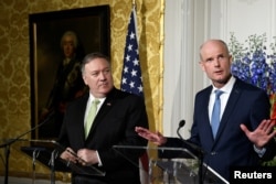 U.S. Secretary of State Mike Pompeo looks on as Dutch Foreign Minister Stef Blok gestures during a joint news conference in The Hague, Netherlands, June 3, 2019.