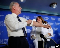 In 2017, Health and Human Services Secretary Tom Price rolls-up his sleeve for a flu vaccination from Nurse Sharon Walsh-Bonadies. This was part of a news conference recommending everyone age six months and older get vaccinated against influenza..