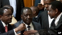 FILE - Opposition presidential candidate Raila Odinga (C) and his running mate, Kalonzo Musyoka (L), with their lawyer James Orengo (R), are seen at the Kenya Supreme Court, in Nairobi, Sept. 1, 2017. 