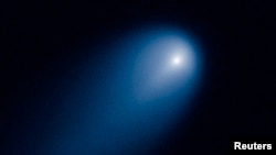 Comet ISON is shown in this NASA handout photographed by the Hubble telescope, Apr. 10, 2013.