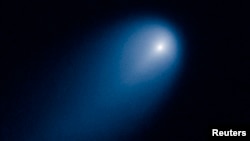 Comet ISON is shown in this NASA handout photographed by the Hubble telescope, April 10, 2013.